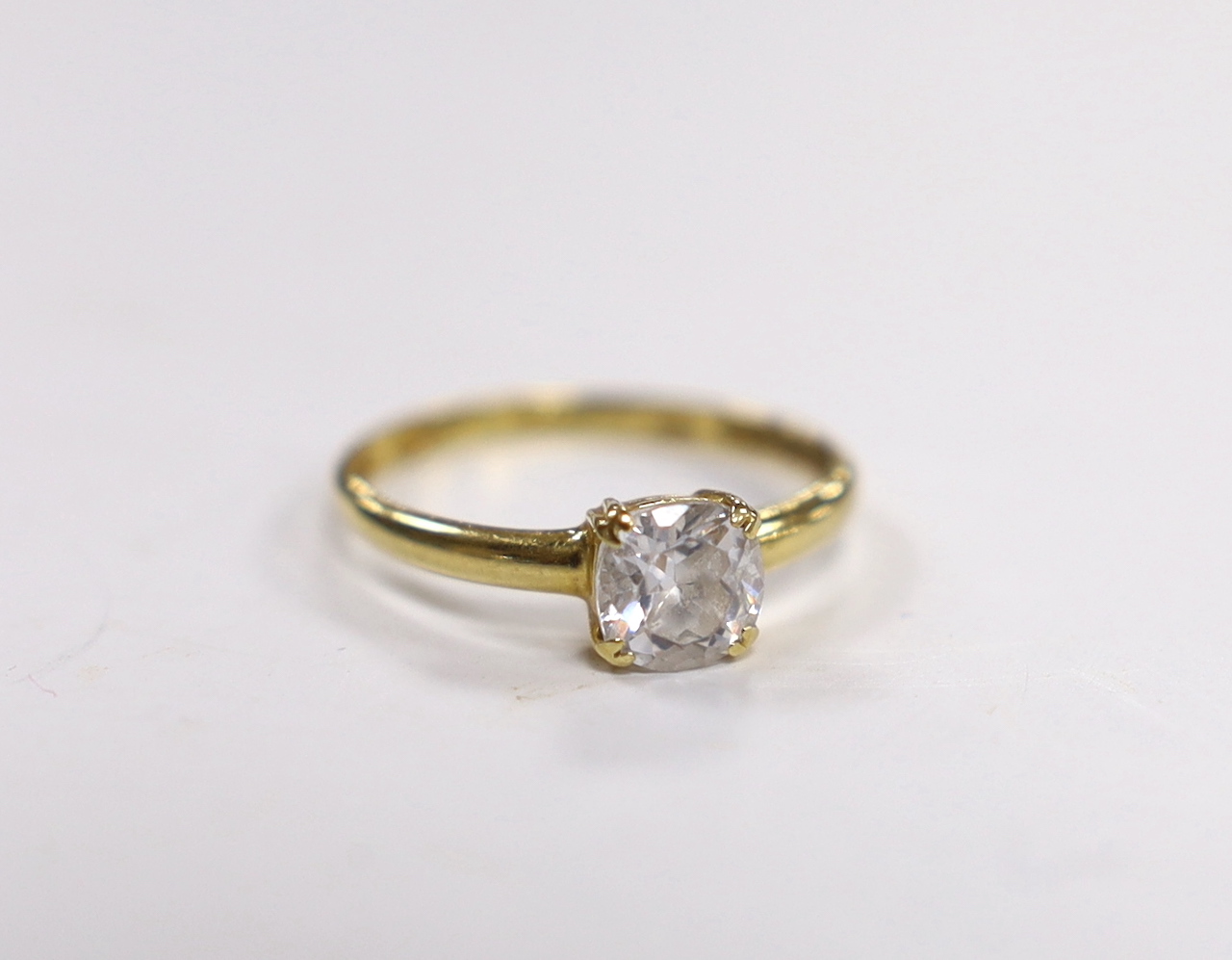 A 750 yellow metal and simulated diamond set ring, size N/O. gross weight 1.8 grams.